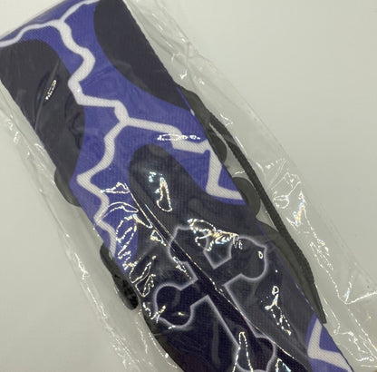 Guitar strap with blue, white and black design on a clear background