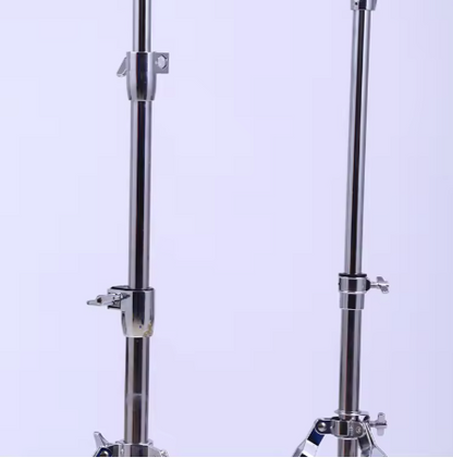 Two chrome metal stands on a light purple background showing extensions for height