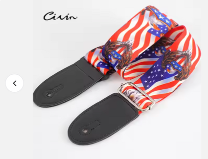Guitar strap with American flag design and black plastic hardware on a white background