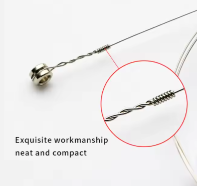 Close-up of a silver guitar string showing wind on a white background
