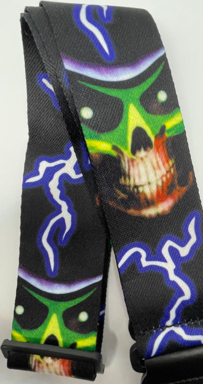 Black guitar strap with colorful abstract skull design on a white background